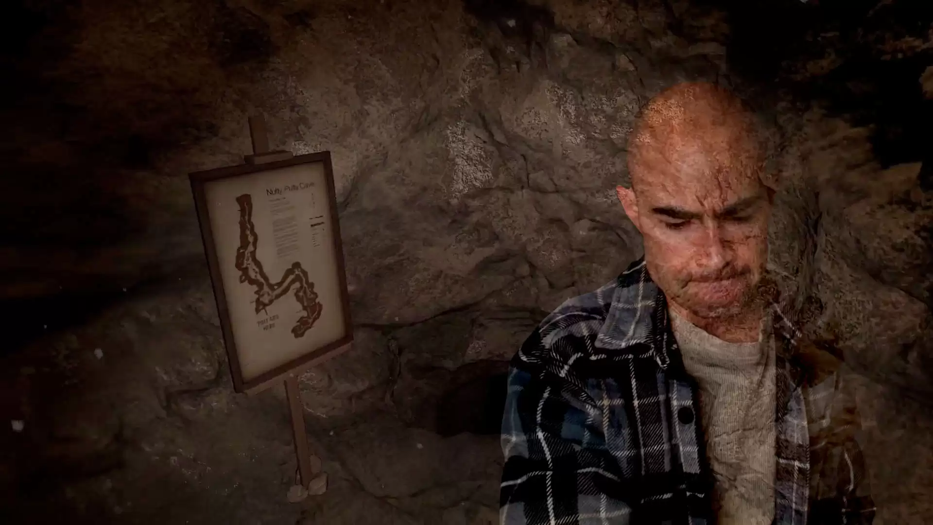 transparent image of brandon kowallis against the nutty putty cave entrance with the map on a sign